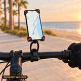 X-Grip phone holder mounted on a handlebar by the beach (phone not included)