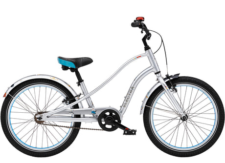 Children's bicycle with silver frame and black tires on a white background