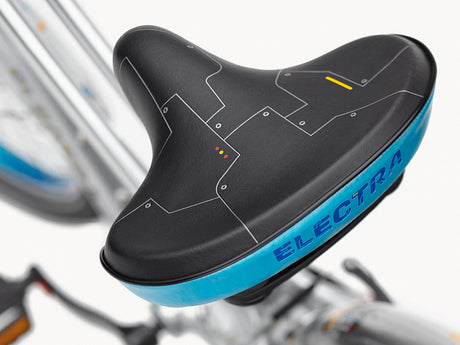 Black and blue Electra bicycle seat on a blurred background