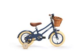 Children's bicycle with a basket on a white background