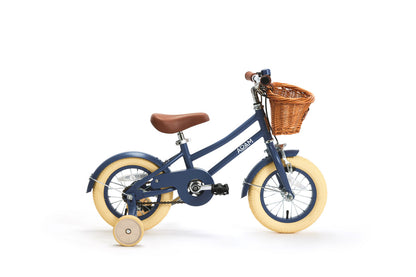 Children's bicycle with a basket on a white background