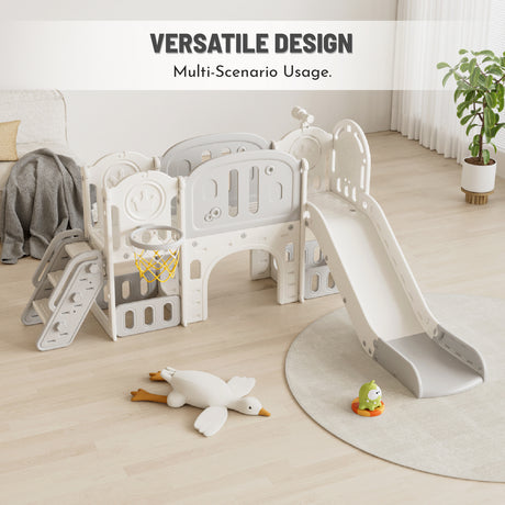 Children's play structure with slide and climbing panels on a wooden floor, featuring toys.