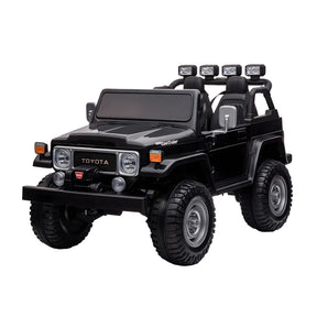 Black toy car resembling a Toyota model on a white background