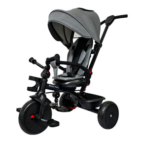 Children's tricycle with grey canopy on a white background