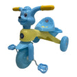 Blue and yellow children's tricycle with a cartoon face on a white background