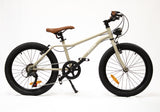Beige children's bike with black tires on a white background