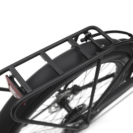 Black bicycle rack attached to a bike wheel on a white background