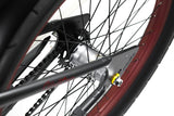 Close-up of a bicycle chain and gear system on a white background