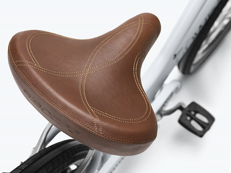 Brown bicycle seat on a white background