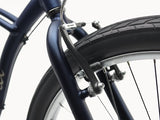 Close-up of a bicycle's front wheel and suspension fork on a white background