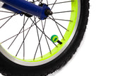 Close-up of a bicycle wheel with a blue hub and green valve cap on a white background