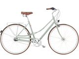 Light green bicycle with brown seat and tires on a white background