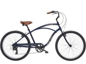 Navy blue bicycle with brown seat on a white background