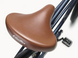 Brown bicycle seat with 'Electra' branding on a white background