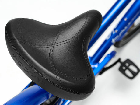 Close-up of a black bicycle seat on a blue bike frame.
